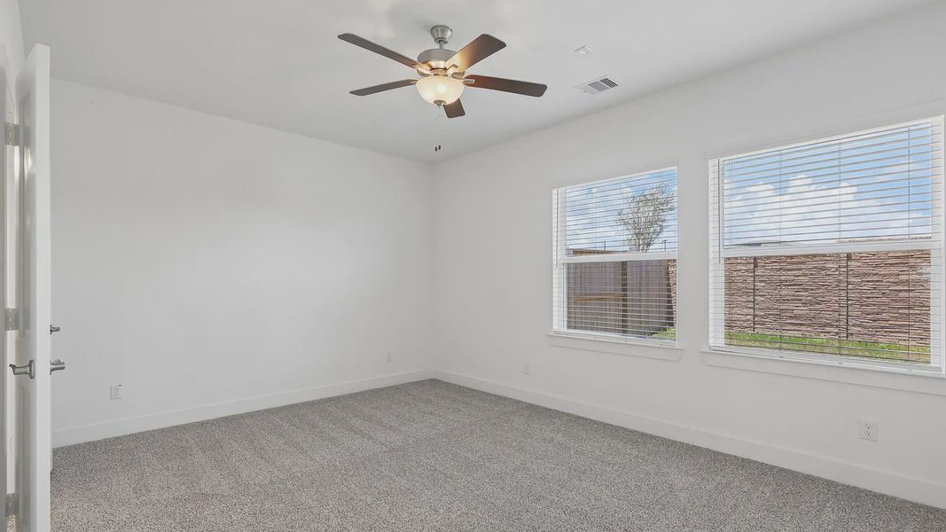 Spacious, unfurnished interior of a new home in Meridiana Townhomes, Iowa Colony (Image 21).
