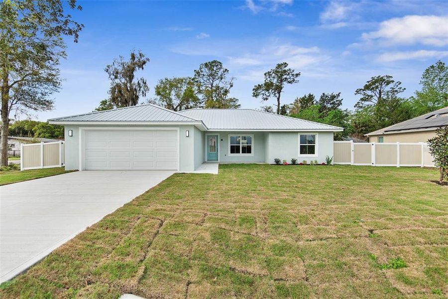 Front exterior of a new home in , Bunnell, FL, highlighting curb appeal (Image 28).