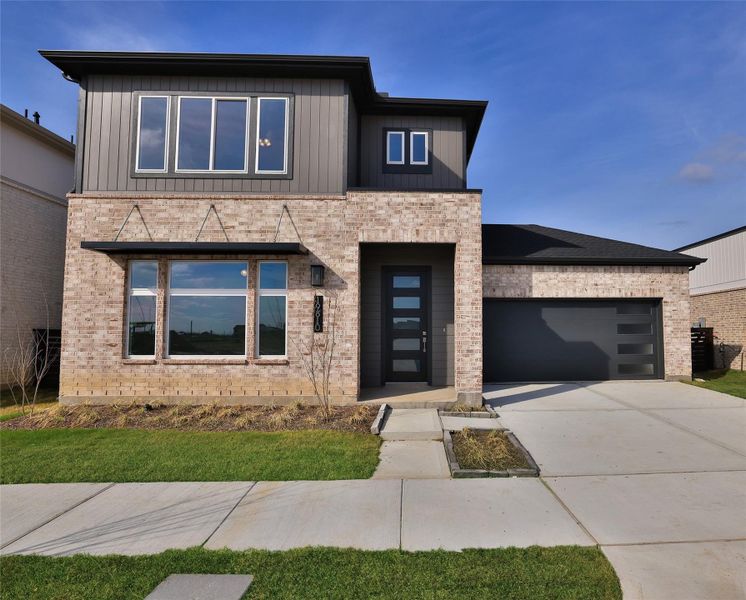 Front exterior of a new home in Bridgeland Central, Cypress, TX, highlighting curb appeal (Image 1). Front exterior of a new home in Bridgeland Central, Cypress, TX, highlighting curb appeal (Image 1).