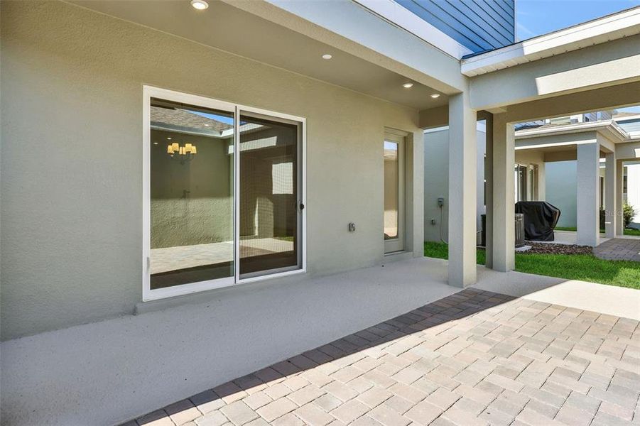 Exterior details and patio area of a home in Serenade at Ovation, Winter Garden (Image 4). Exterior details and patio area of a home in Serenade at Ovation, Winter Garden (Image 4).