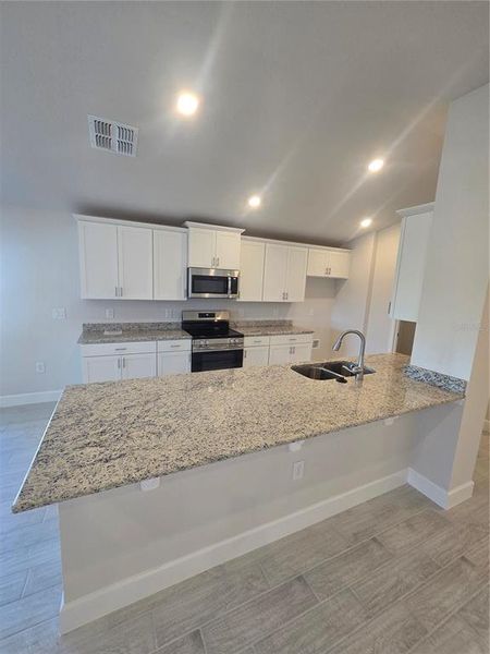 Furnished interior view inside a new home in Wyld Palms, Inverness (Image 6). Furnished interior view inside a new home in Wyld Palms, Inverness (Image 6).