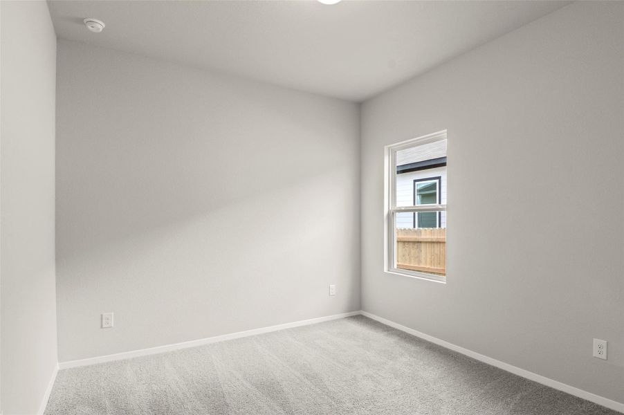 Unfurnished room with carpet and baseboards