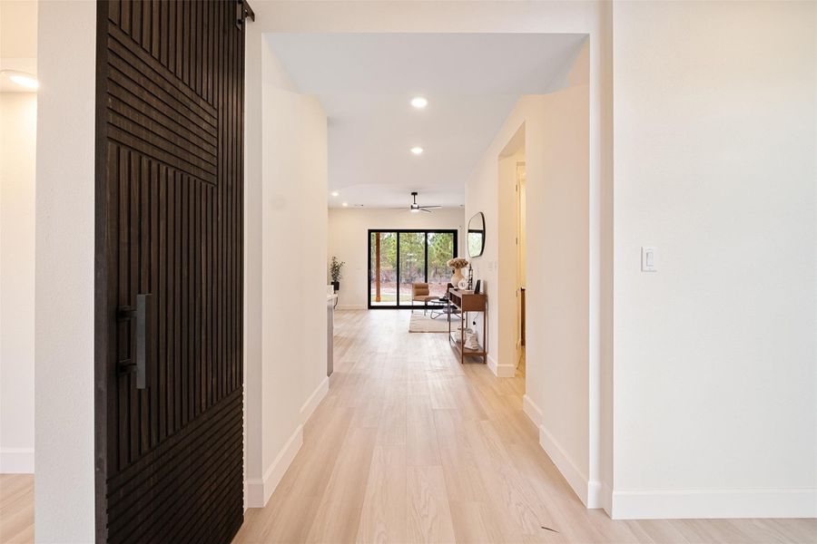 Corridor featuring recessed lighting and light wood finished floors