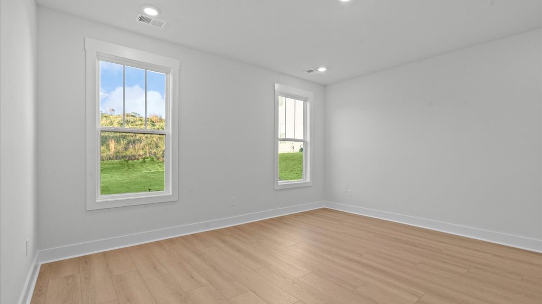 First-rate hardwood flooring and thoughtful upgrades in this select townhome by DRB Homes