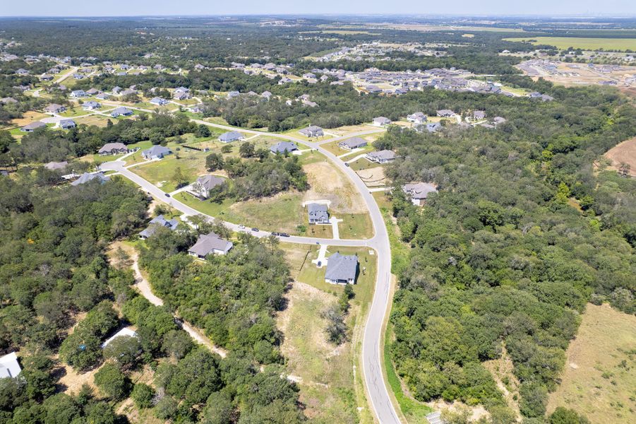 Double Eagle Ranch, a thoughtfully planned neighborhood known for its rolling Hill Country views, 1-acre homesites, and proximity to both Austin and Bastrop