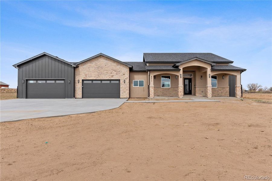 Front exterior of a new home in , Fort Lupton, CO, highlighting curb appeal (Image 25).