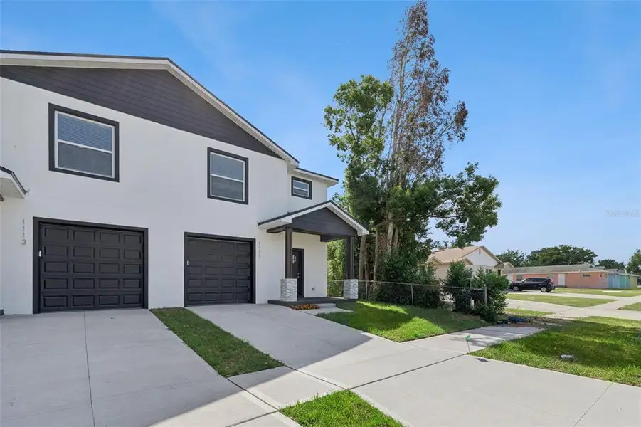Front exterior of a new home in , Lakeland, FL, highlighting curb appeal (Image 20).