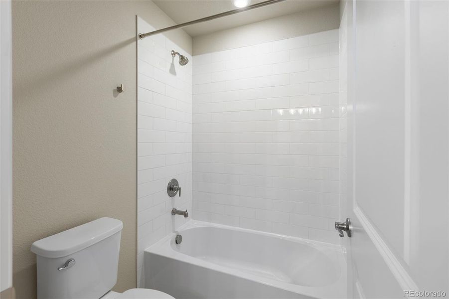 Furnished interior view inside a new home in Woodrose at Painted Prairie, Aurora (Image 8).