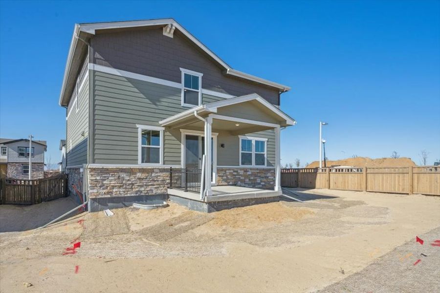 A house with a fence around it. A house with a fence around it.