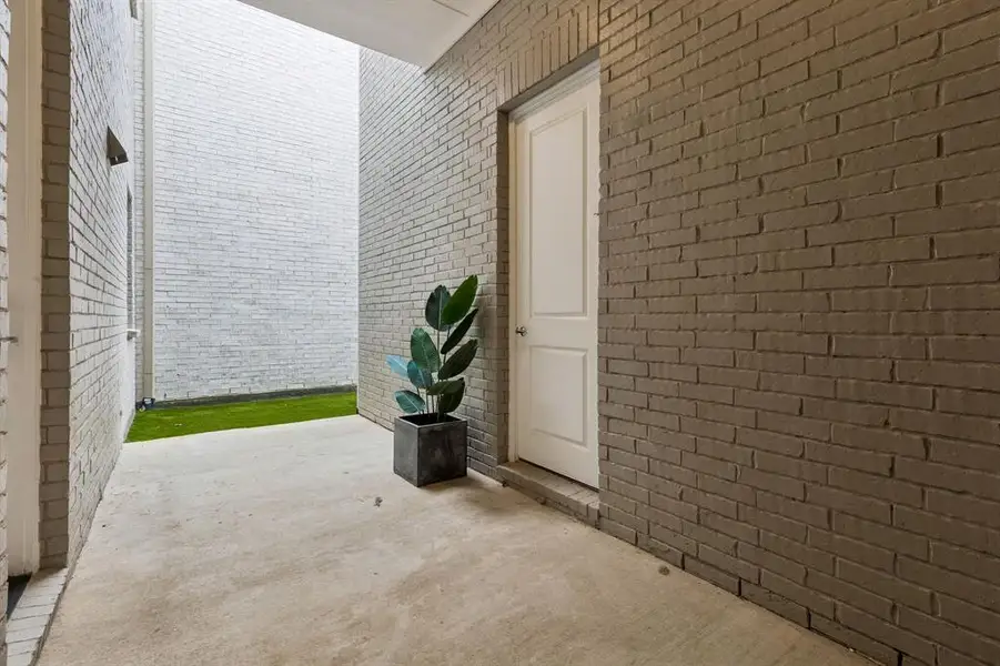 Exterior details and patio area of a home in Newman Village Townhomes, Frisco (Image 4). Exterior details and patio area of a home in Newman Village Townhomes, Frisco (Image 4).