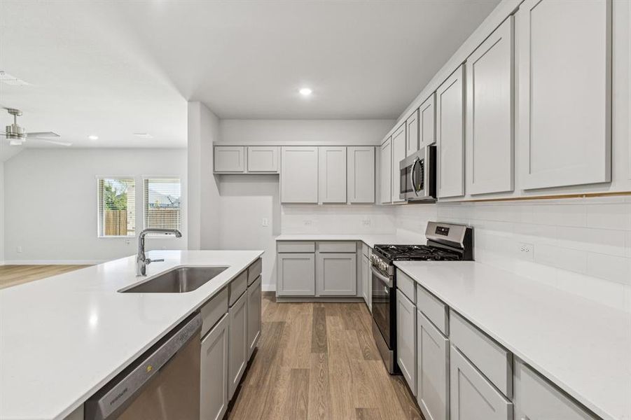 Kitchen in the Oscar home plan by Trophy Signature Homes – REPRESENTATIVE PHOTO Kitchen in the Oscar home plan by Trophy Signature Homes – REPRESENTATIVE PHOTO