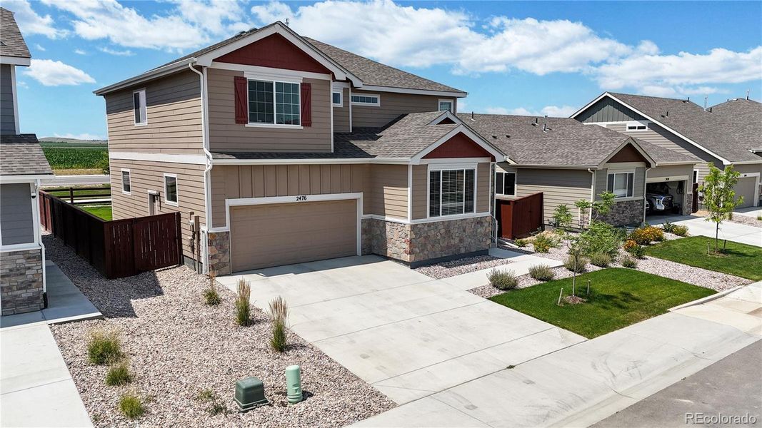 Front exterior of a new home in Ravina, Windsor, CO, highlighting curb appeal (Image 2). Front exterior of a new home in Ravina, Windsor, CO, highlighting curb appeal (Image 2).
