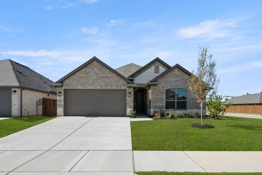 Front exterior of a new home in Summer Crest, Fort Worth, TX, highlighting curb appeal (Image 2). Front exterior of a new home in Summer Crest, Fort Worth, TX, highlighting curb appeal (Image 2).