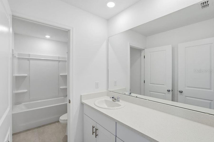 Furnished interior view inside a new home in Waterstone, Groveland (Image 31).