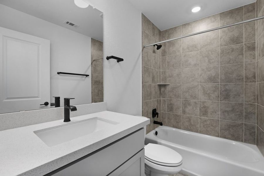 Furnished interior view inside a new home in Travisso, Leander (Image 10).