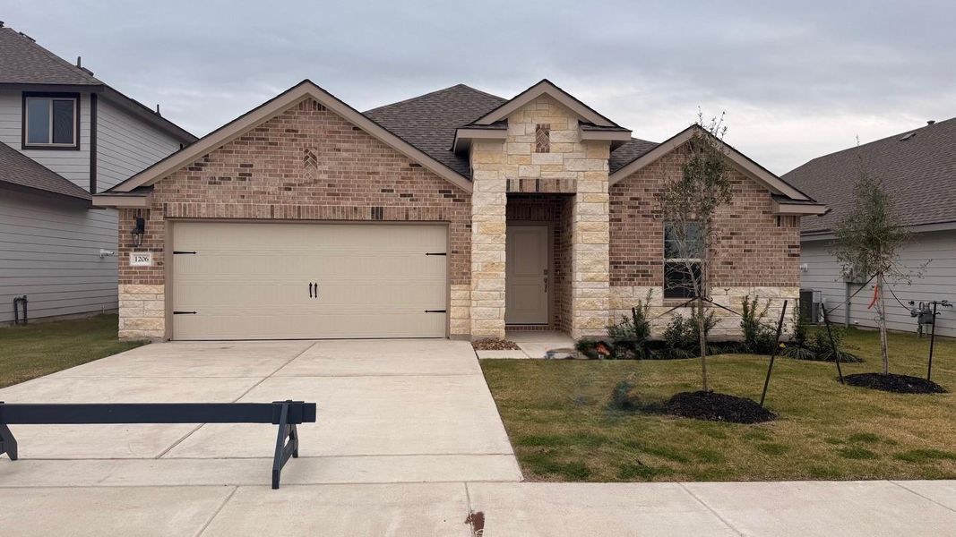 Front exterior of a new home in Southern Pointe, College Station, TX, highlighting curb appeal (Image 1). Front exterior of a new home in Southern Pointe, College Station, TX, highlighting curb appeal (Image 1).