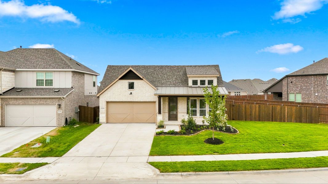 Front exterior of a new home in The Oaks, Red Oak, TX, highlighting curb appeal (Image 2). Front exterior of a new home in The Oaks, Red Oak, TX, highlighting curb appeal (Image 2).