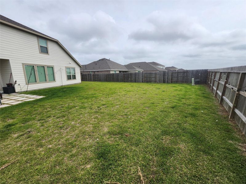 Exterior details and patio area of a home in Walnut Creek at Stone Creek: Wildflower II Collection, Rosenberg (Image 4).