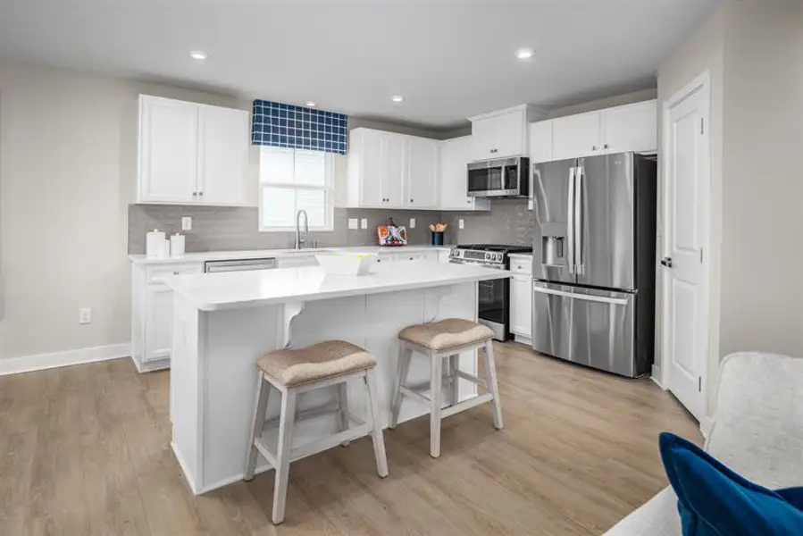 Furnished interior view inside a new home in Reidville Town Center Cottages, Duncan (Image 4).