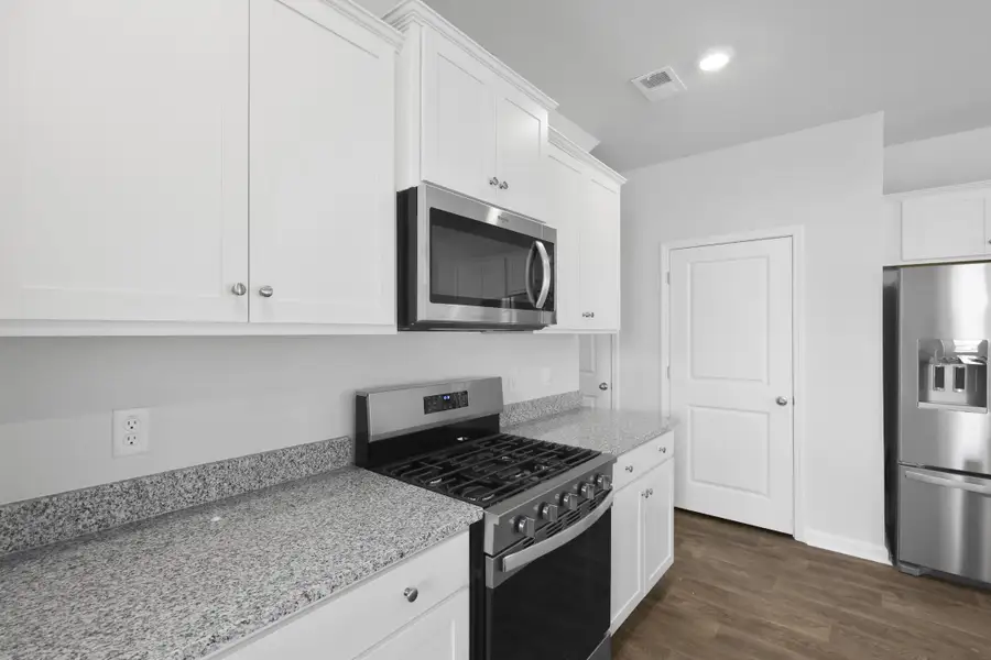 Furnished interior view inside a new home in Pine Hills at Cane Bay, Summerville (Image 6).