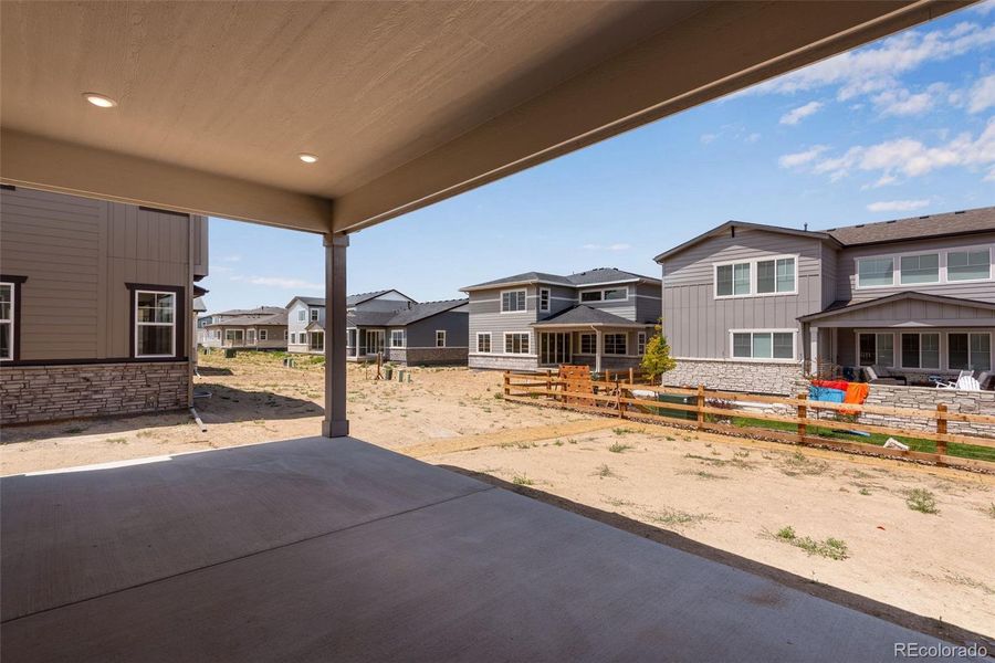Front exterior of a new home in Prelude at The Aurora Highlands, Aurora, CO, highlighting curb appeal (Image 26). Front exterior of a new home in Prelude at The Aurora Highlands, Aurora, CO, highlighting curb appeal (Image 26).