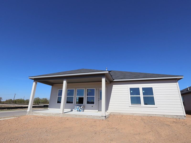 Exterior details and patio area of a home in Carillon, Manor (Image 9).