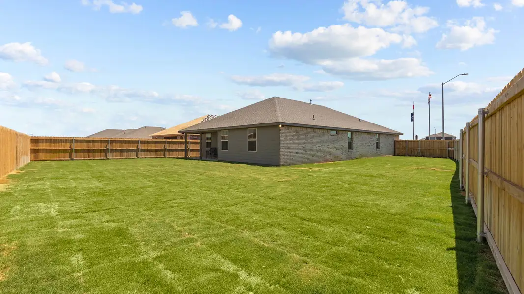 Representative exterior photo of a completed home built from the KINGSTON by D.R. Horton in Homestead at Parks Bell Ranch, Odessa, TX (Image 4).