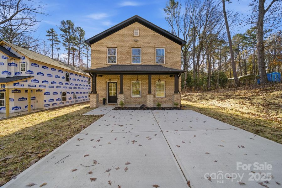 Front exterior of a new home in , Albemarle, NC, highlighting curb appeal (Image 1).