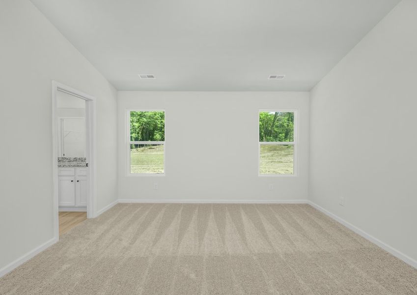 This master bedroom has ample natural light and enough space for your king-sized furniture This master bedroom has ample natural light and enough space for your king-sized furniture