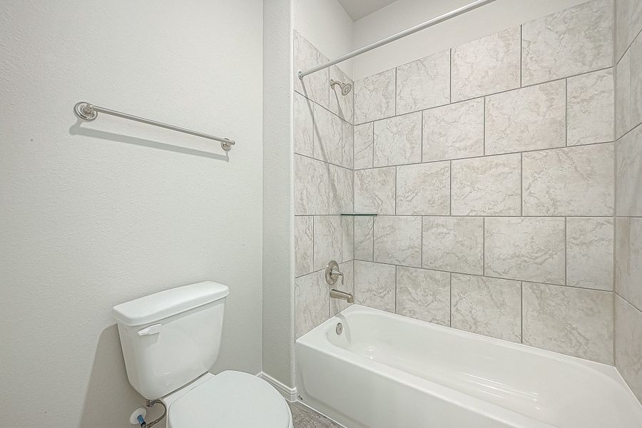 Representative furnished interior of a home built from the Floor Plan 2050 by Colina Homes in Grand Magnolia, Magnolia (Image 32).