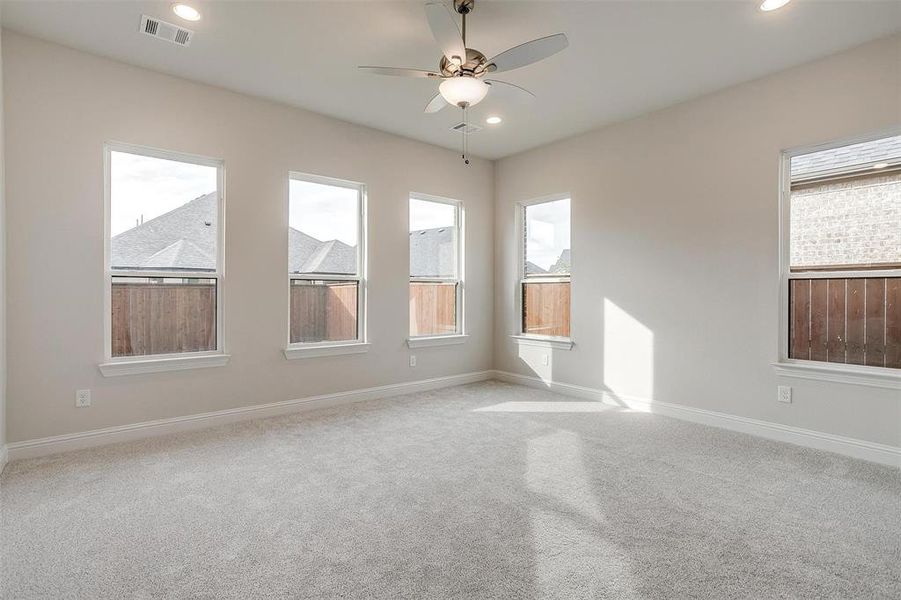 Unfurnished room with light carpet and ceiling fan