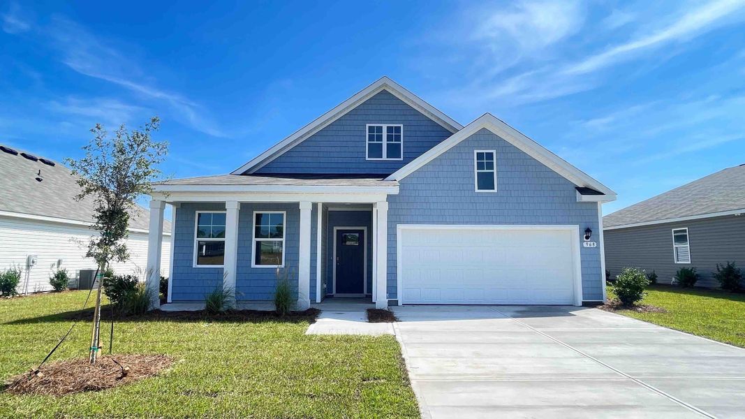Front exterior of a new home in Stanbury Creek, Supply, NC, highlighting curb appeal (Image 1).