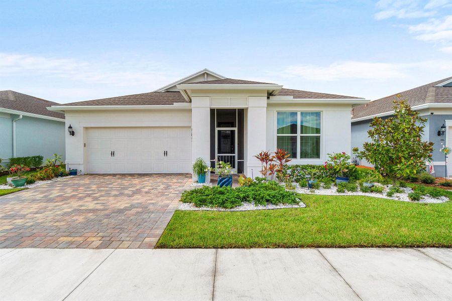 Front exterior of a new home in , Port St. Lucie, FL, highlighting curb appeal (Image 1).
