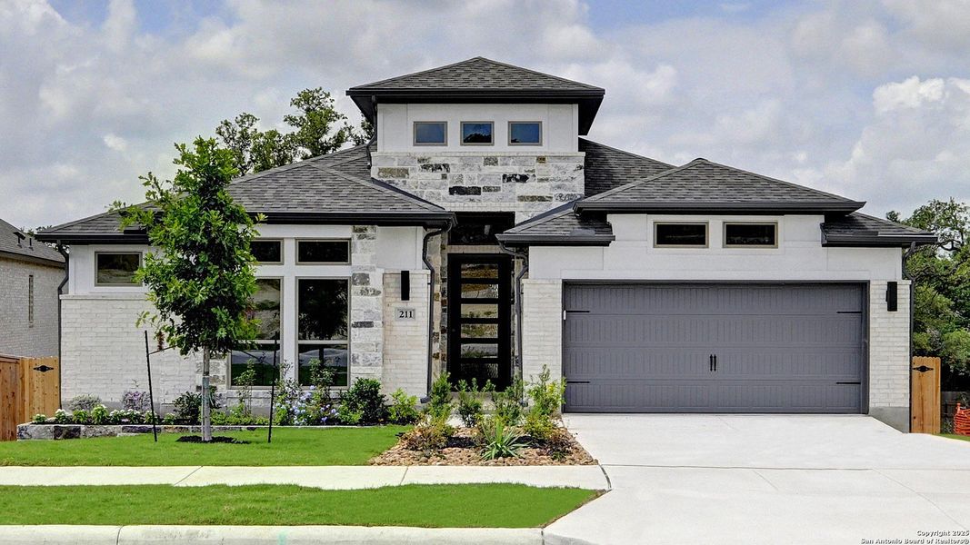 Front exterior of a new home in Ranches At Creekside 55', Boerne, TX, highlighting curb appeal (Image 2). Front exterior of a new home in Ranches At Creekside 55', Boerne, TX, highlighting curb appeal (Image 2).