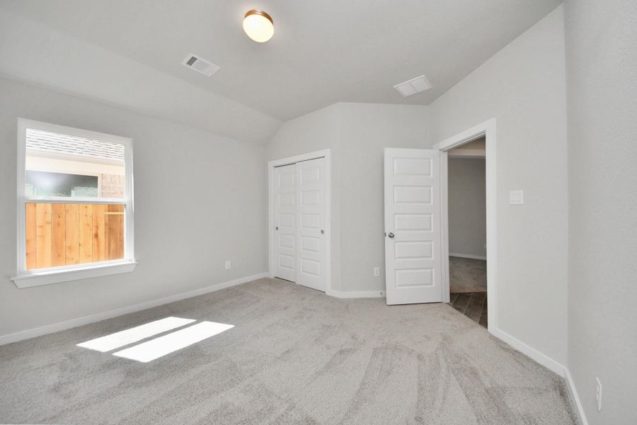 Generously sized secondary bedrooms featuring spacious closets, soft and inviting carpeting underfoot, large windows allowing plenty of natural light, and the added touch of privacy blinds for your personal retreat. Sample photo of completed home with similar floor plan. Actual colors and selections may vary. Generously sized secondary bedrooms featuring spacious closets, soft and inviting carpeting underfoot, large windows allowing plenty of natural light, and the added touch of privacy blinds for your personal retreat. Sample photo of completed home with similar floor plan. Actual colors and selections may vary.