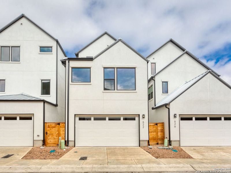Front exterior of a new home in Victoria Commons, San Antonio, TX, highlighting curb appeal (Image 23).