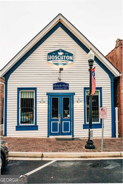 Front exterior of a new home in Rosewood Lake Estates, Hoschton, GA, highlighting curb appeal (Image 57).