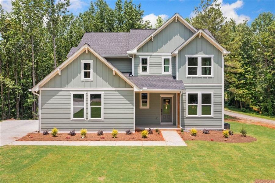 Front exterior of a new home in , White, GA, highlighting curb appeal (Image 1). Front exterior of a new home in , White, GA, highlighting curb appeal (Image 1).