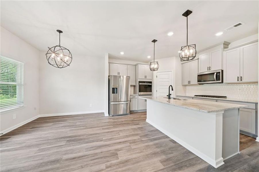 Furnished interior view inside a new home in Vines at Mill Creek - Estate Series, Braselton (Image 11).