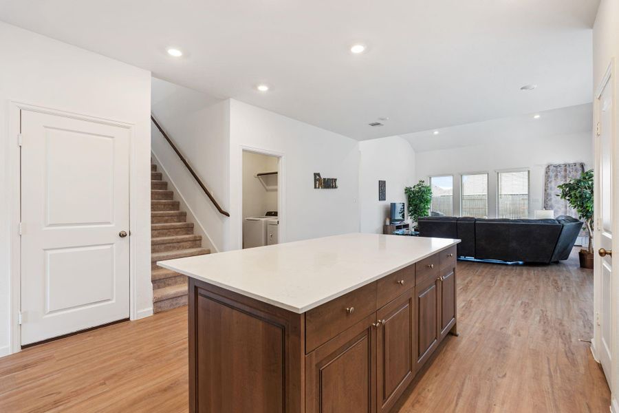 Stairway is privately tucked away next to the kitchen and leads to the game room and 3 bedrooms!