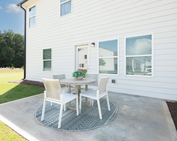 The back patio is perfect for relaxing or entertaining. The back patio is perfect for relaxing or entertaining.
