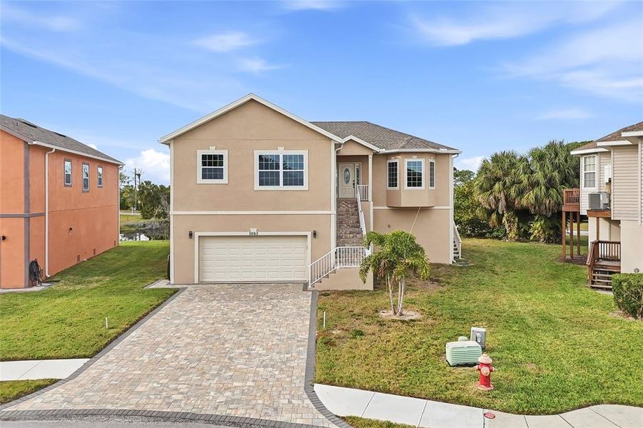Front exterior of a new home in , Tarpon Springs, FL, highlighting curb appeal (Image 26).
