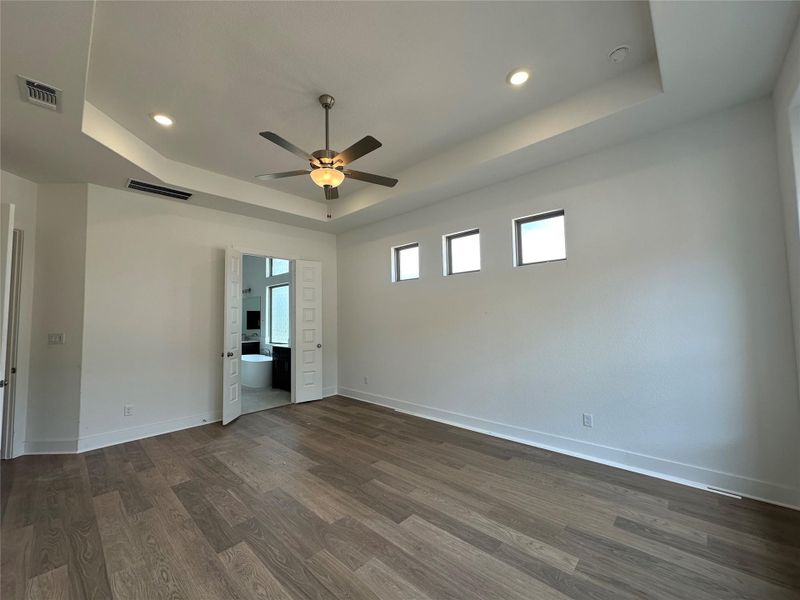 Primary Bedroom with elevated ceiling