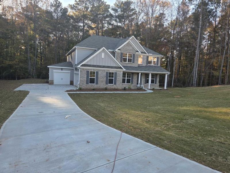 Front exterior of a new home in Ruby Creek Estates, Atlanta, GA, highlighting curb appeal (Image 2). Front exterior of a new home in Ruby Creek Estates, Atlanta, GA, highlighting curb appeal (Image 2).