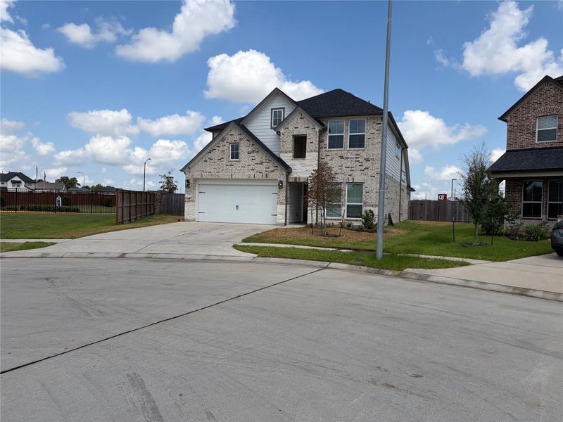 Front exterior of a new home in Morton Creek Ranch, Katy, TX, highlighting curb appeal (Image 22).