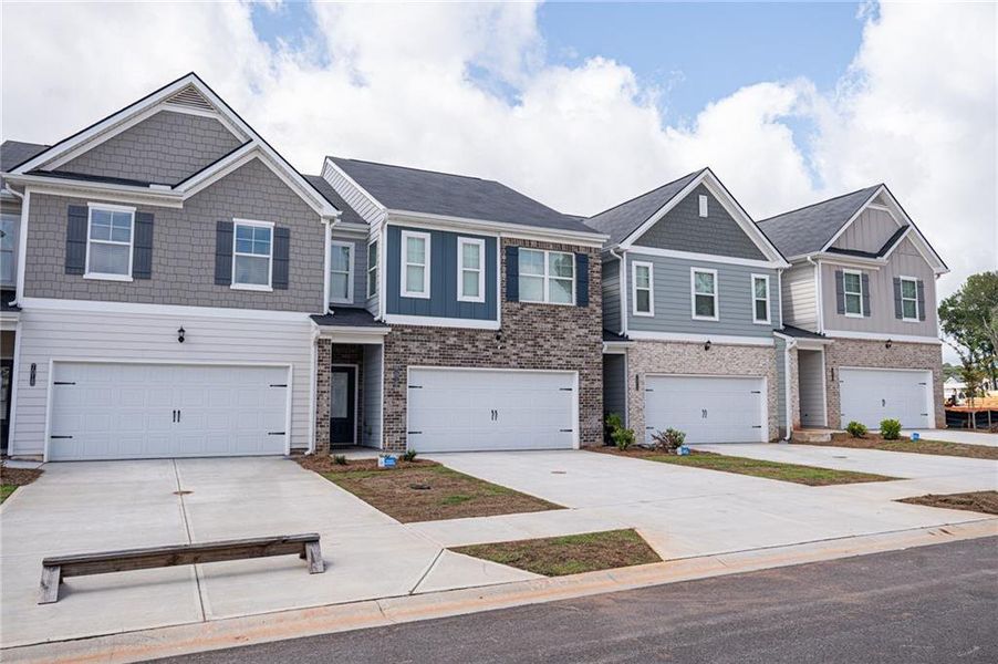 Front exterior of a home in the Fairview Lake Townhomes community, located in Conyers, GA (Image 2). Front exterior of a home in the Fairview Lake Townhomes community, located in Conyers, GA (Image 2).