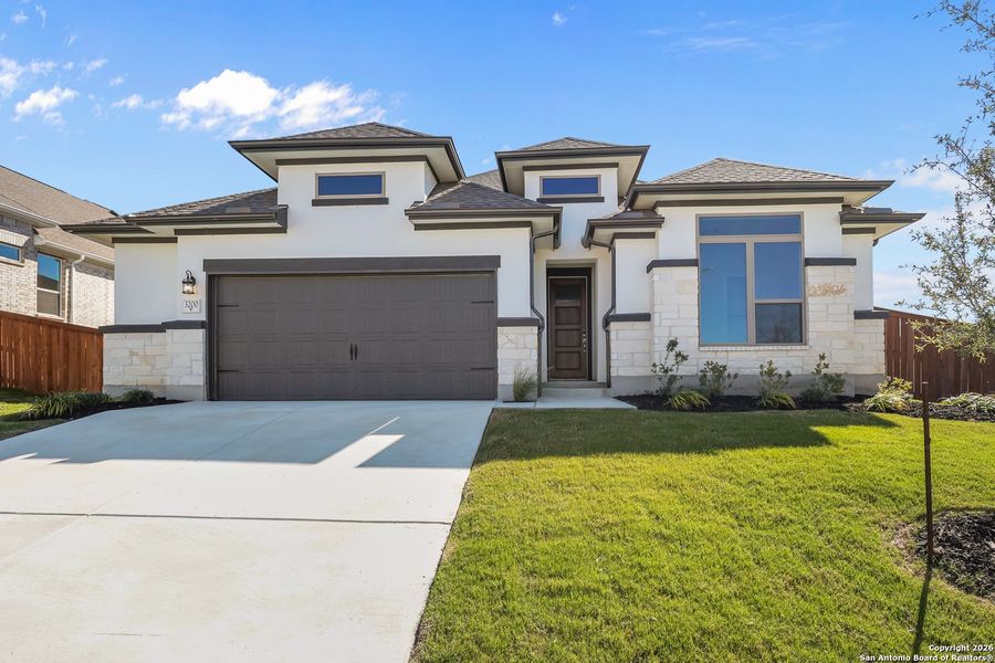 Front exterior of a new home in Homestead 65', Schertz, TX, highlighting curb appeal (Image 22).