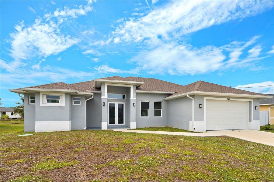 Front exterior of a new home in , Lehigh Acres, FL, highlighting curb appeal (Image 25).