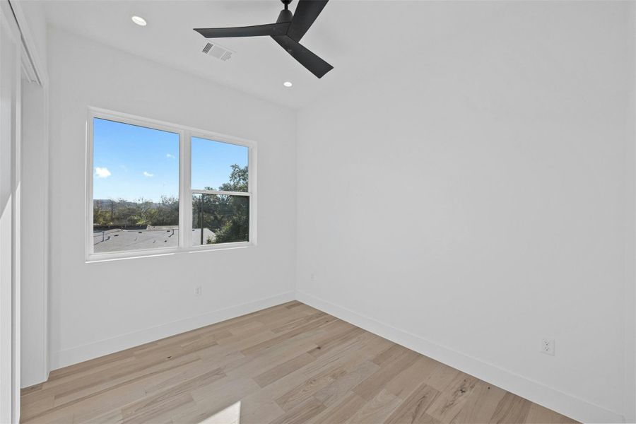 Unfurnished room with light wood-style floors, recessed lighting, and ceiling fan Unfurnished room with light wood-style floors, recessed lighting, and ceiling fan