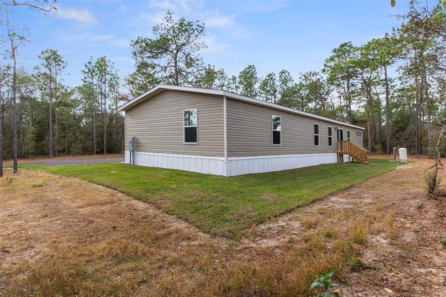 Exterior details and patio area of a home in , Brooksville (Image 19). Exterior details and patio area of a home in , Brooksville (Image 19).